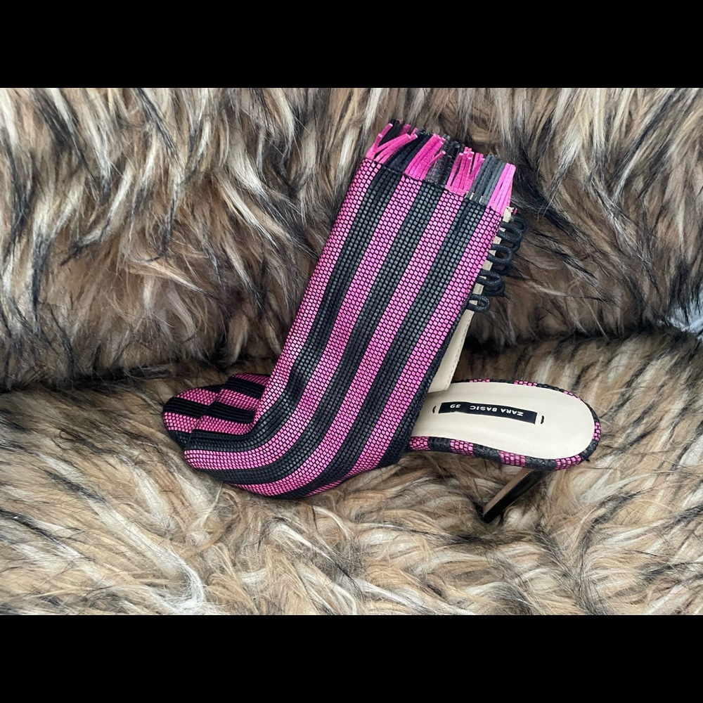 Pink and black ankle heels.
